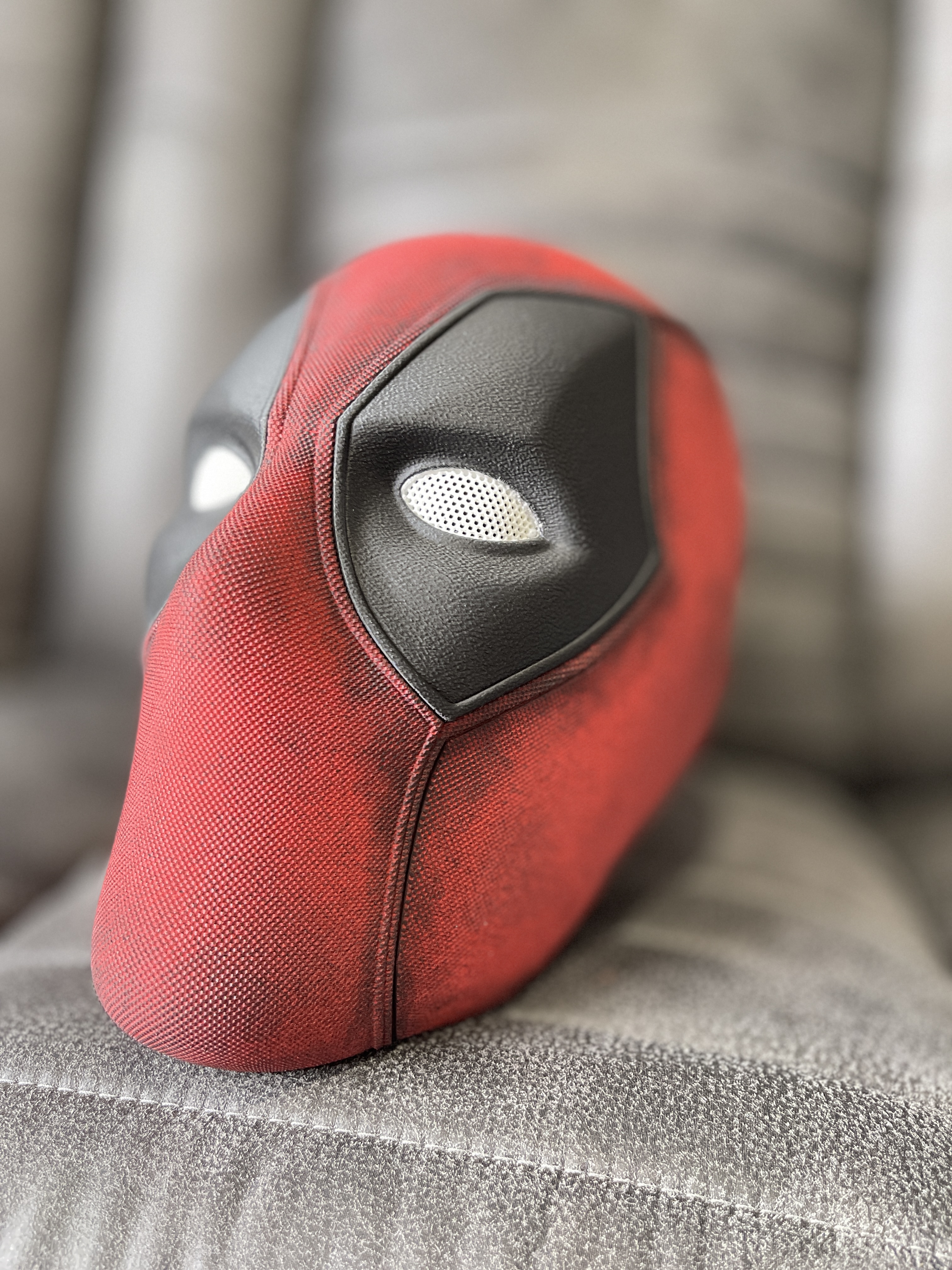 Deadpool-inspired mask detail — hand-painted red and black finish with mesh eyes