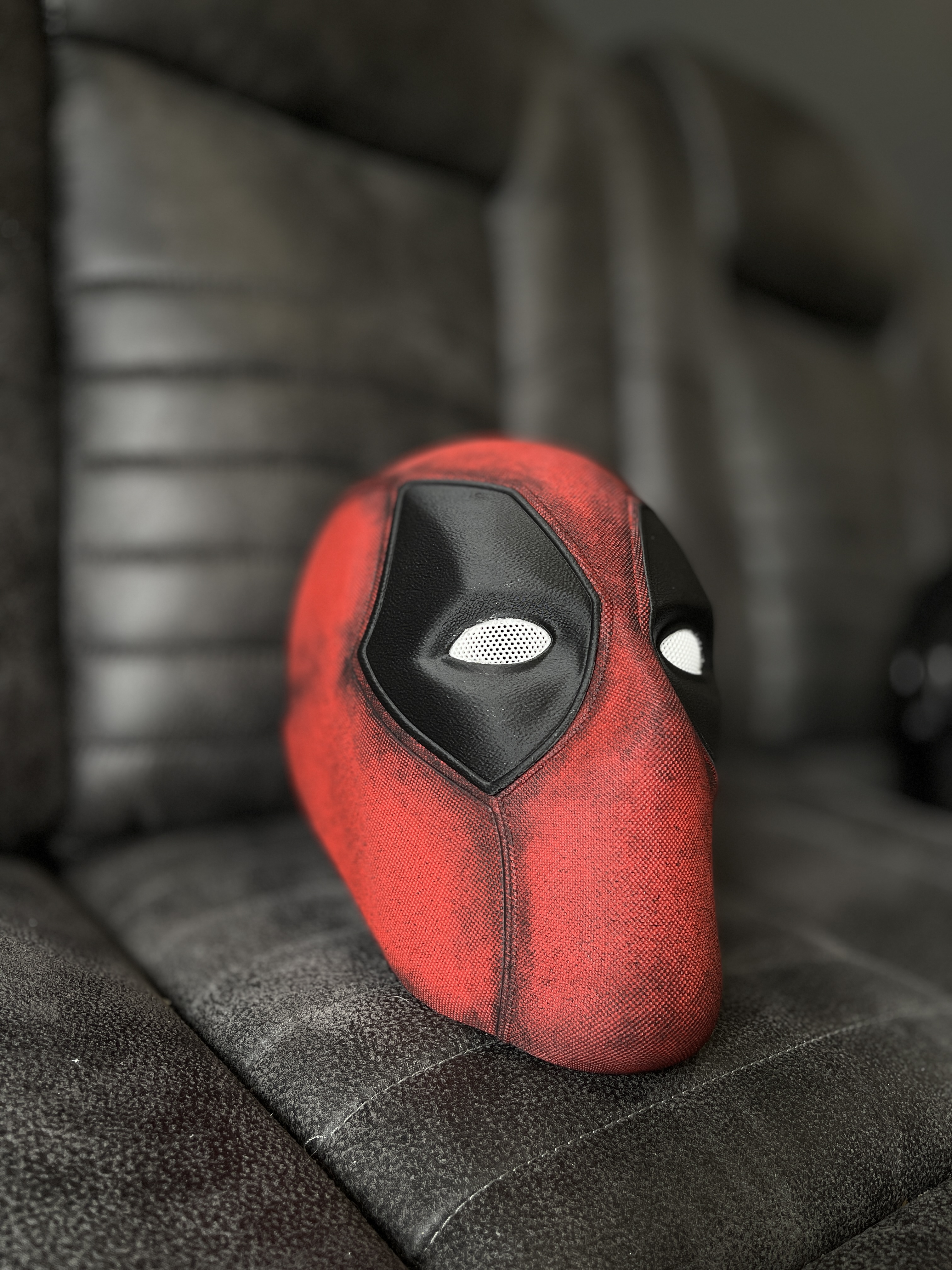 Deadpool-inspired mask detail — hand-painted red and black finish with mesh eyes