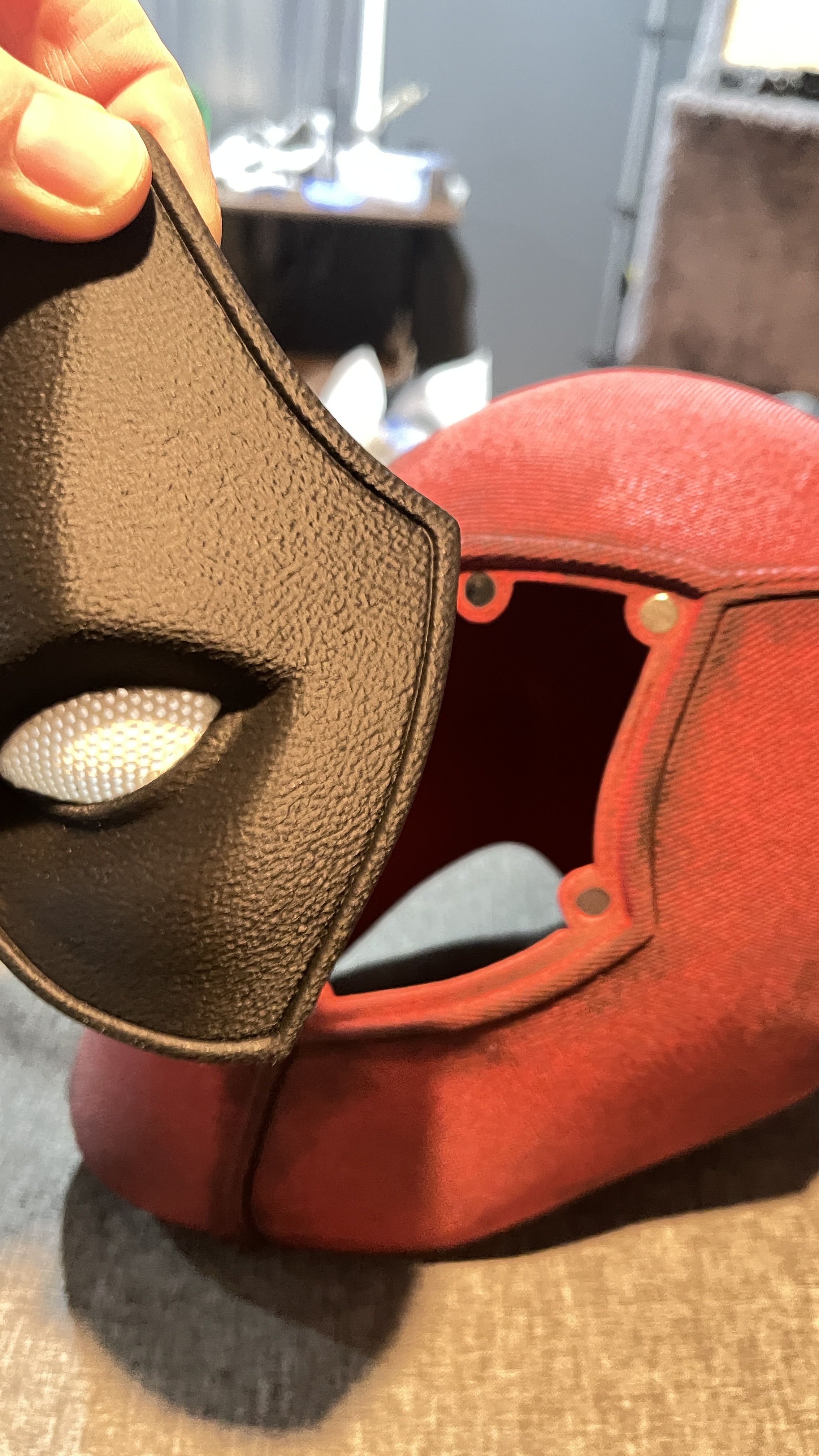 Deadpool-inspired mask detail — hand-painted red and black finish with mesh eyes