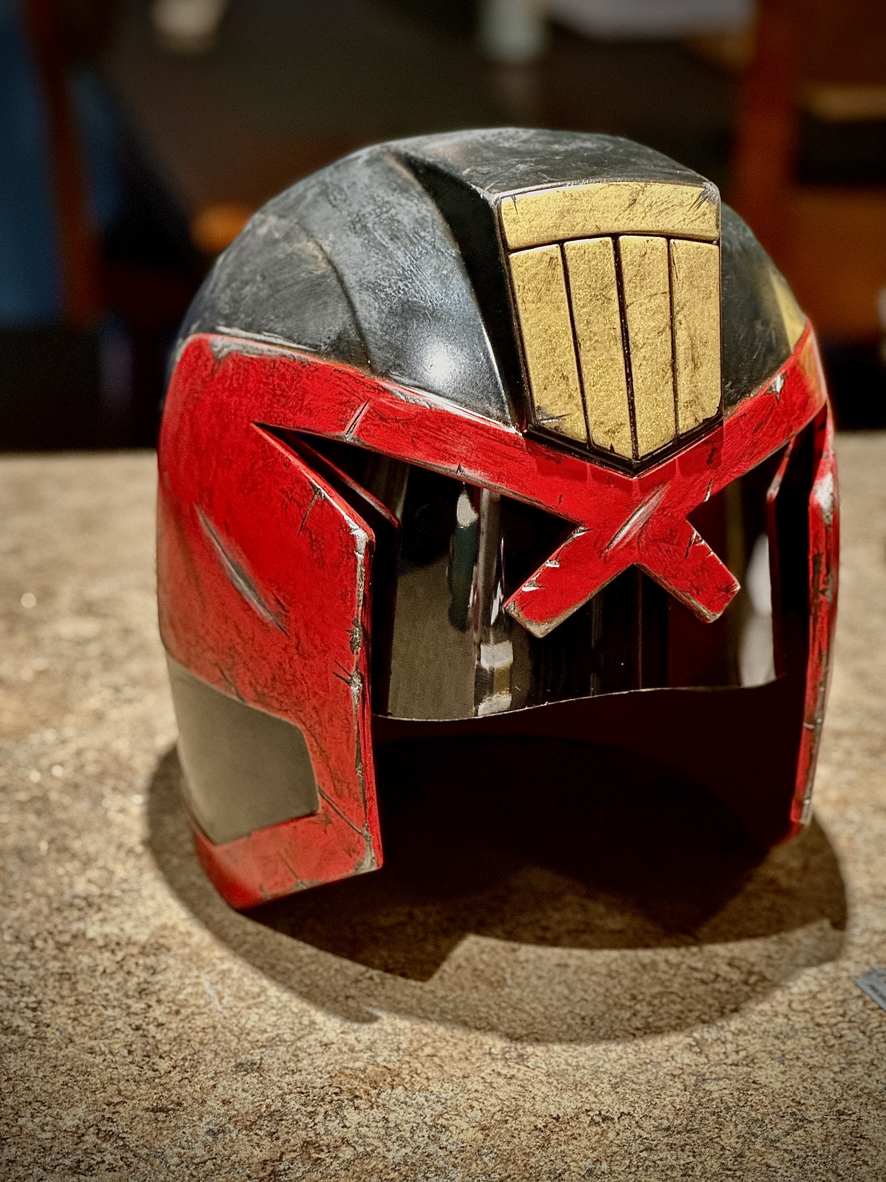 Judge Dredd-inspired cosplay helmet detail — hand-painted battle-worn finish and tinted visor