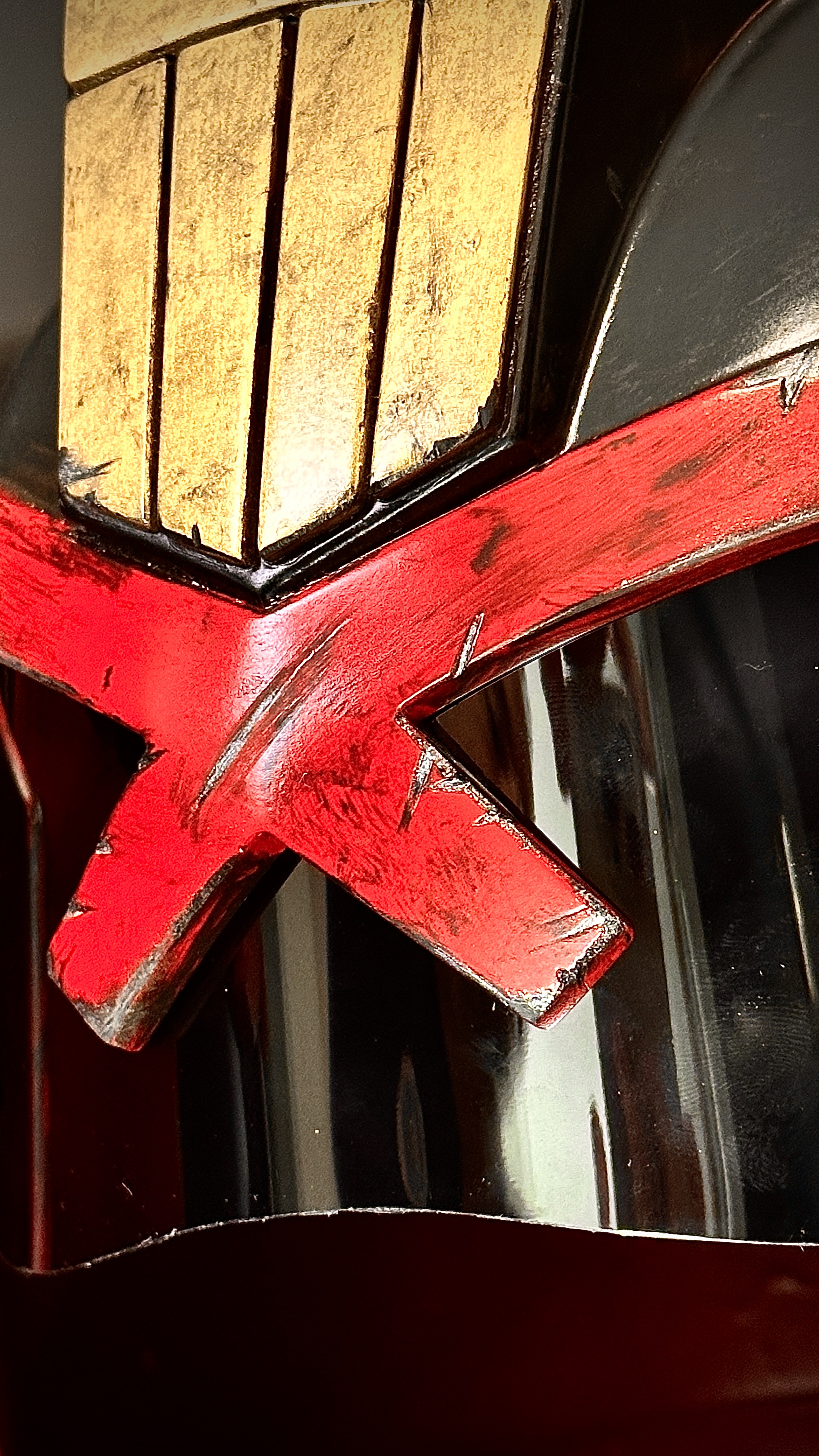 Judge Dredd-inspired cosplay helmet detail — hand-painted battle-worn finish and tinted visor