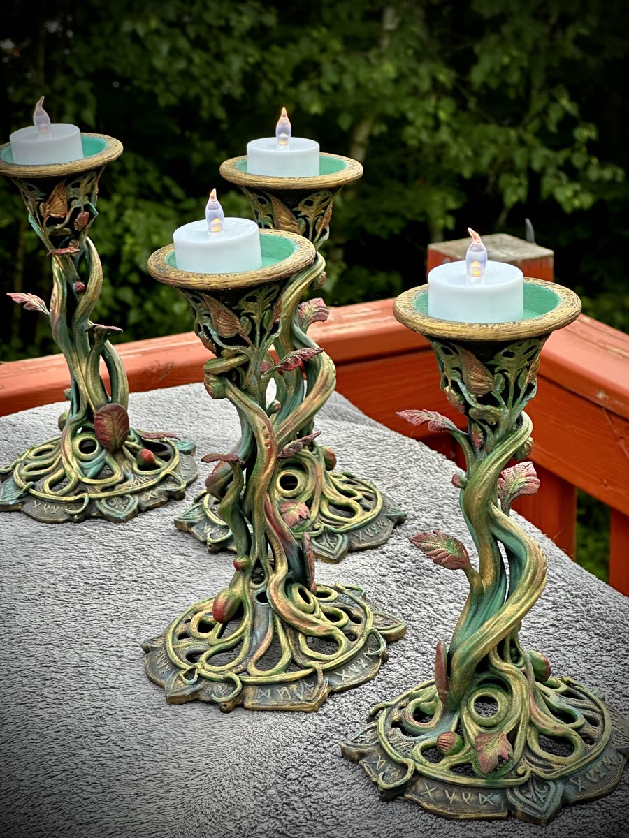 Completed hand-painted botanical candle holders for a wedding